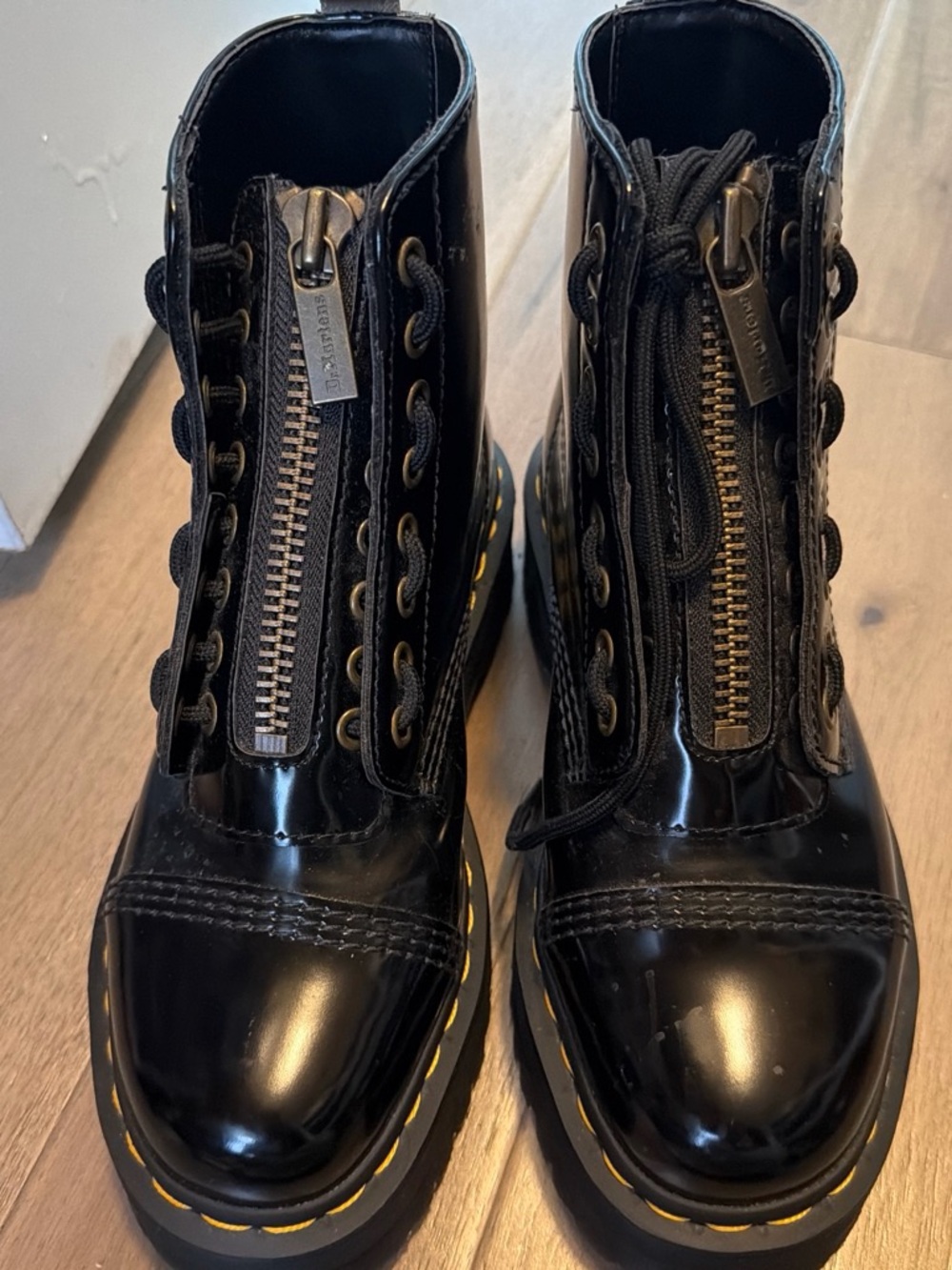 Dr. Martens Black Patent Combat Boots with Yellow Stitching